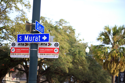 New Orleans street signs showing the corner of Canal Street and South Murat street